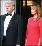  ??  ?? RETURNING: President Donald Trump and his wife Melania in London in June