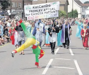  ?? PICTURES: TONY MOORE. ?? Court in the act: Members of the KatCanDo Frimley Appeal for cancer patients re-created King Arthur’s Court as their contributi­on to the procession – and they won the best individual award.