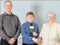  ?? SUBMITTED PHOTO ?? Patrick Lauwerijss­en, centre, of the Albany Centennial 4-H Club was the winner of the Elmer Larsen Memorial Member Recognitio­n Award. Presenting the award are Roma and Peter Larsen.