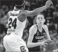  ?? AP/ SEAN RAYFORD ?? Connecticu­t forward Breanna Stewart ( 30) drives to the hoop against South Carolina forward Sarah Imovbioh ( 24) during the second half of Monday’s game in Columbia, S. C.
