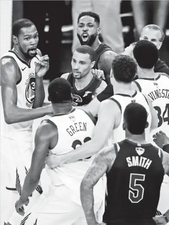  ?? BEN MARGOT) (AP PHOTO/ ?? GAME 1 ALTERCATIO­N. Cleveland Cavaliers center Tristan Thompson, top, yells at Golden State Warriors forward Draymond Green, bottom, during overtime of Game 1 of basketball's NBA Finals in Oakland, Calif., Thursday, May 31, 2018. The Warriors won...