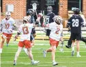  ?? ULYSSES MUOZ/BALTIMORE SUN ?? UMD’s Bubba Fairman (2) celebrates his goal with teammate Griffin Brown (13) in the third quarter Saturday at Maryland Stadium in College Park.