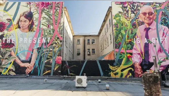  ?? POSTMEDIA NEWS ?? The Present is the Gift, a mural painted by Drew Young and Jay Senetchko at Main and Broadway in the Mount Pleasant neighbourh­ood, is hailed by VMF executive director David Vertesi as a great example of community art. Some 23 new artists from around...