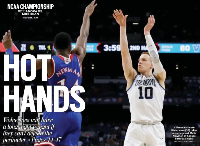  ?? THE ASSOCIATED PRESS ?? Villanova’s Donte DiVincenzo (10) takes a shot against Malik Newman of Kansas Saturday night.