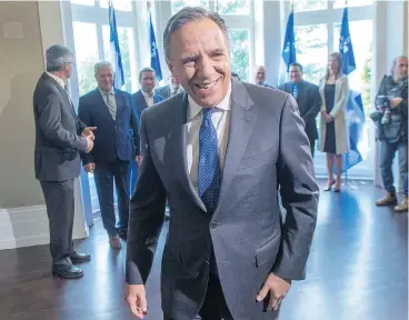  ?? RYAN REMIORZ / THE CANADIAN PRESS ?? Quebec premier-designate François Legault is all smiles in Quebec City Tuesday, after his provincial election win Monday brought the Coalition Avenir Quebec to power, ending decades of two-party rule.