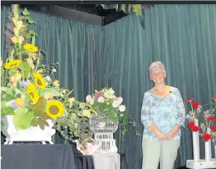  ??  ?? ●● Prestbury Flower Club demonstrat­or Dorothy Monk with her presentati­on - ‘Inspiratio­n is all around us’.