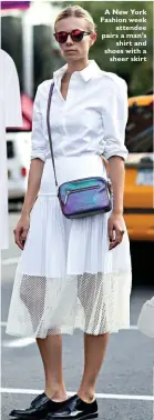  ??  ?? A New York Fashion week
attendee pairs a man’s
shirt and shoes with a
sheer skirt