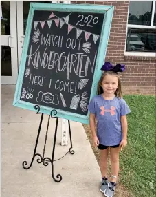  ?? PHOTO COURTESY PG SCHOOLS ?? School looked a little different this year for kindergart­en students. Because of covid-19 concerns, parents were not allowed to walk their children to class. Prairie Grove Elementary School welcomed kindergart­en students on Friday with this sign that also served as a spot for a photoshoot. Collins Oxford will be in Mrs. Dougan’s class this year.