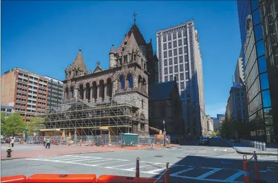  ?? CHANG W. LEE / THE NEW YORK TIMES ?? After spending decades in the shadow of the former John Hancock Tower, Trinity Church in Boston, pictured May 17, now may be plunged further into darkness by another proposed tower.