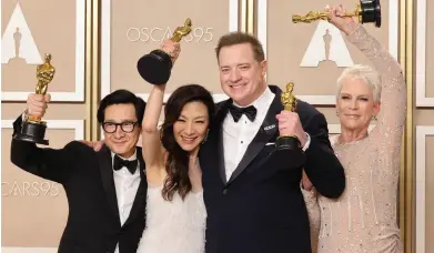  ?? ?? A24 stars, from left: Ke Huy Quan, Michelle Yeoh, Brendan Fraser and Jamie Lee Curtis in the press room after their Oscar wins.