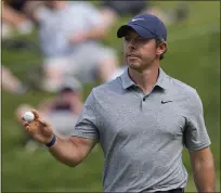  ?? DARRON CUMMINGS — THE ASSOCIATED PRESS ?? Rory McIlroy of Northern Ireland after a birdie on the 17th hole during the third round of the Memorial golf tournament Saturday in Dublin, Ohio.