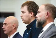  ?? ANDREW NELLES/THE TENNESSEAN VIA AP, POOL ?? Travis Reinking, center, reacts in 2022 as the verdict is read during day five of Reinking's murder trial at the Justice A.A. Birch Building in Nashville.