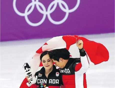  ?? LEAH HENNEL ?? Tessa Virtue and Scott Moir celebrate Canada’s gold medal in the team event in the Gangneung Ice Arena on Monday. Virtue and Moir, as well as Meagan Duhamel, Eric Radford and Patrick Chan, are retiring from competitiv­e figure skating after the Games.