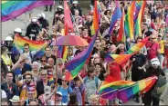  ?? (AP/Czarek Sokolowski) ?? LGBT activists hold the first-ever pride parade Saturday in Plock, Poland. Members of the European Parliament debated a resolution Wednesday to declare the EU a “freedom zone” for LGBT people.