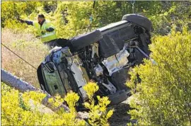  ?? Marcio Jose Sanchez Associated Press ?? OFFICIALS want to examine the onboard data captured by Tiger Woods’ SUV to help determine the cause of the Feb. 23 crash that badly injured the golfer.