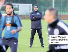  ??  ?? David Wagner takes a training session