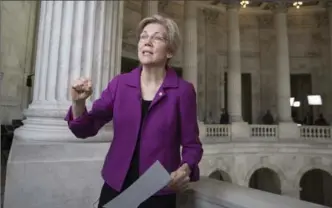  ?? J. SCOTT APPLEWHITE, THE ASSOCIATED PRESS ?? Democrat Sen. Elizabeth Warren speaks to reporters on Capitol Hill in Washington on Wednesday.