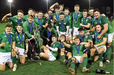  ??  ?? Winners: Ireland’s Under-20 squad celebrate their Grand Slam win last Friday night