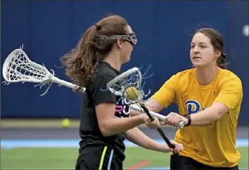  ?? Matt Freed/Post-Gazette ?? Coach Emily Boissonnea­ult, right, began laying on-field groundwork for the new program in the winter, but progress was cut short when the pandemic closed the PItt campus.