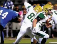  ?? BOB RAINES — DIGITAL FIRST MEDIA ?? Lansdale Catholic’s Brennan Daly escapes Conwell-Egan’s Dwayne Majors Friday night.