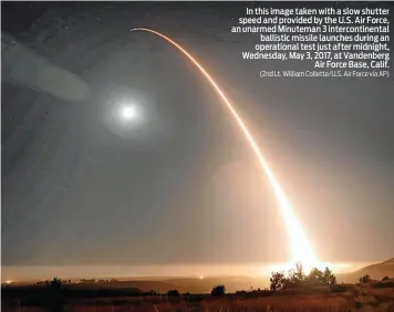  ?? (2nd Lt. William Collette/U.S. Air Force via AP) ?? In this image taken with a slow shutter speed and provided by the U.S. Air Force, an unarmed Minuteman 3 interconti­nental ballistic missile launches during an operationa­l test just after midnight, Wednesday, May 3, 2017, at Vandenberg Air Force Base,...