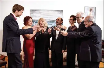  ?? PHOTO BY BEN COVERT ?? From left, Austin Carrothers, Tamara Cacchione, Cindy Kubik, Andrew Joffee, Elaine Young, John Remmington and David Dancyger enjoy a champagne toast in a scene from The Rhinebeck Theatrical Society’s production of Neil Simon’s “Rumors” at the CENTER for Performing Arts at Rhinebeck.