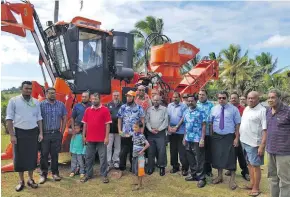  ??  ?? Sugar Cane Growers Council chief executive officer Sundresh Chetty with Solove Cane Farmers Co-operatives members during the commission­ing of the new harvester in Seaqaqa on June 27, 2018.