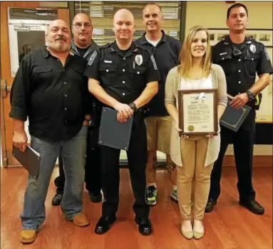  ?? DAN SOKIL — DIGITAL FIRST MEDIA ?? Towamencin police officers receive a group citation and several individual awards Wednesday for their work in rounding up a local drug ring. From left are police Sgt. Gary Wacker, Officers Greg Wert and James Bonner, Sgt. Paul Wiechec, Specialist...