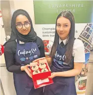  ?? ?? Boxing clever Competitio­n queens Asma and Ava-Grace with their prize coffee cupcakes