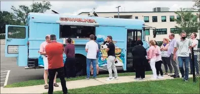  ?? Contribute­d ?? Life is returning to normal this summer at HAI Group in Cheshire, where the specialty insurer has most employees back at the office. HAI is a winner in the Hearst Connecticu­t Media Top Workplaces contest for 2021. Pictured is the company's food truck for Food Truck Friday.