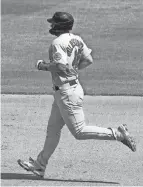  ?? DAVID KOHL/USA TODAY SPORTS ?? Cardinals first baseman Paul Goldschmid­t rounds the bases after hitting a two-run home run during the fourth inning of Game 1 against the Reds.