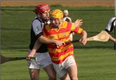  ??  ?? Ian Hawkins under pressure from Fethard’s Garrett Foley.