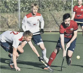  ?? ?? Ben Newman (red) in action for City of Peterborou­gh against Cambridge City. Photo: David Lowndes.