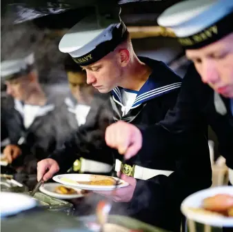  ?? ?? FINALE: Royal Navy personnel tuck into a well-earned cooked breakfast at Victoria Barracks