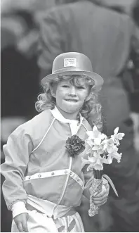  ??  ?? Hillary Hyden, 5, was all decked out in green as she watched St. Patrick’s Day festivitie­s on 16 Mar 1985. Police estimated the crowd watching the events on Madison Avenue at between 35,000 and 40,000.