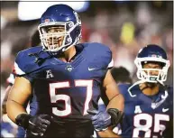  ?? Catherine Avalone / Hearst Connecticu­t Media ?? UConn defensive lineman and former Wilbur Cross star Travis Jones was picked by the Baltimore Ravens in the NFL draft on Friday.