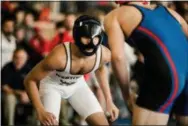  ?? NATE HECKENBERG­ER — MEDIANEWS GROUP ?? Westtown’s Mohammad Mustafa eyes an attack against Germantown Academy’s Jamie McGrath in a loss by fall in the 113-pound consolatio­n final.