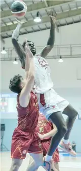  ?? PHOTOGRAPH COURTESY OF NCAA ?? ALPHA Bah shows his might, delivering 23 points and nine rebounds to lift PCU-Batangas to an 84-78 win over Guang Ming College-Tagaytay City in the UCAL-PG Flex Linoleum Season 6.