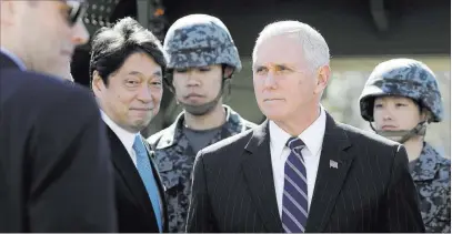  ?? Kiyoshi Ota ?? The Associated Press Vice President Mike Pence leaves Wednesday after inspecting a PAC-3 intercepto­r missile system with Japanese Defense Minister Itsunori Onodera, second from left, at the Defense Ministry in Tokyo.