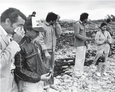  ?? DAVID COOPER TORONTO STAR FILE PHOTO ?? Relatives of the Air India Flight 182 crash victims pay tribute to the dead in Ireland in June 1985. In “Outcaste” by Sheila James, the day after the plane goes down, character Rayappa scours the passenger list for his granddaugh­ter’s name.