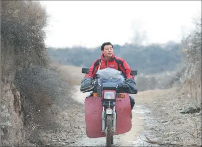  ?? SUN RUISHENG / CHINA DAILY ?? Barefoot doctor He Xinglong has made 170,000 trips in the mountains, covering more than 400,000 kilometers, to visit patients at home in the past 17 years.