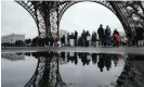  ?? AFP/Getty Images ?? Visitors queue to enter the Eiffel Tower on the day it reopened after the industrial action. Photograph: Dimitar Dilkoff/