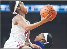  ?? NWA Democrat-Gazette/J.T. WAMPLER ?? Arkansas’ Devin Cosper drives to the basket to score two of her eight points in the Razorbacks’ 91-57 victory over Texas-Arlington on Sunday at Walton Arena in Fayettevil­le.