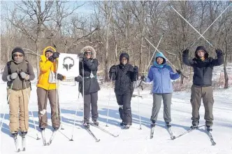  ??  ?? An Outdoor Afro group takes cross-country skiing lessons at the Cook County Forest Preserves’ Camp Sagawau in January 2019.