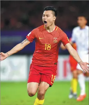  ?? GUO YONG / XINHUA ?? Team China’s Gao Lin celebrates scoring a penalty in the 84th minute of Thursday’s 1-0 World Cup Asian Zone qualifying match against Uzbekistan in Wuhan, Hubei province.