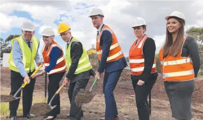  ?? Picture: ANDREW POTTS ?? Paul Fletcher and Mark Bailey (both middle) turn the first sod yesterday at the upgrade of the M1 between Mudgeeraba and Varsity Lakes.