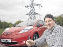  ??  ?? Neil Swanson of Rosyth with his Leaf. Interest in electric cars in Scotland is growing.