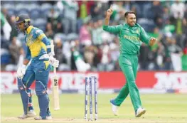  ??  ?? Seamer Faheem Ashraf (R) was the pick of a bristling Pakistani attack, taking a career best five for 22 as the hosts were skittled for just 67.