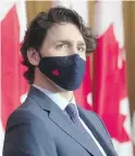  ?? CP ?? Prime Minister Justin Trudeau listens to speakers appearing by video during a news conference in Ottawa.