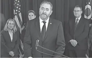  ?? OHIO ATTORNEY GENERAL’S OFFICE ?? Ohio Attorney General Dave Yost announces the indictment­s of two former Akron-based Firstenerg­y executives and ex-public Utilities Commission of Ohio Chairman Sam Randazzo on Feb. 12.